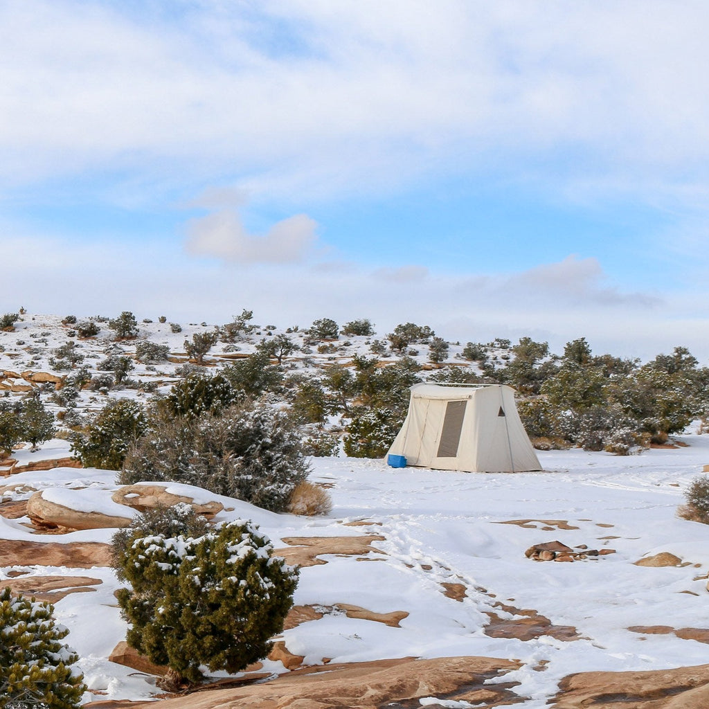 springbar canvas tent winter camping in desert with snow 